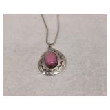 Silver necklace with a pink gemstone inlay