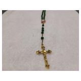 Jade bead necklace with gold cross and Virgin Mary
