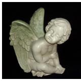 Modern cherub figurine.