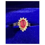 Ladies 10k gold ring w/ a ruby & diamonds.
