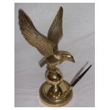 Vintage brass eagle perched on a globe w/ pen.