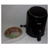 Air fryer w/ parchment paper liners.