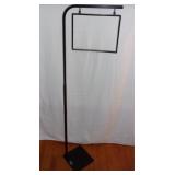 Adjustable pallet sign holder.