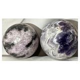 Polished natural amethyst crystal spheres.
