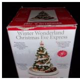 Illuminated musical circling train mini village.