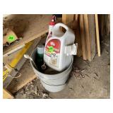 Bucket of bug and weed killer