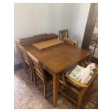 Dining table and 6 chairs and leafs.