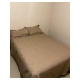 Full size bed with bedding