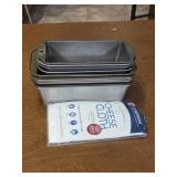 11 bread pans and a cheese cloth