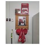 Farmall baseball hats sign and hat holder