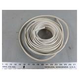 Coiled White Flexible Polymer Extrusion Strip