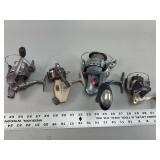Group of Four Assorted Spinning Fishing Reels Featuring Abu Garcia and Quantum Brands