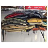 Assortment of Personal Flotation Devices and Cabelas Vests