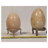Two Carved Stone Eggs with Metal Display Stands