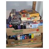 Assorted VHS Movie Tapes and Documentaries in Cardboard Storage Boxes