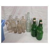 Assorted Glass Bottles and Green Glass Flip-Top Beer Bottles