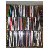 Assorted Audio Compact Discs Featuring Various Artists and Genres