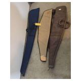 Three Firearm Cases Including Blue Nylon, Tan Canvas and Brown Leather Models