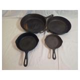 Four Cast Iron Skillets Including Wagner Sidney and Marked Sizes