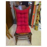 Wooden Rocking Chair with Carved Seat and Red Cushion