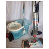 Floor Care Lot Including Rubbermaid Spray Mop, Spin Mop with Bucket, and Bissell Vacuum