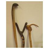 Three Hand-Carved Wooden Walking Sticks with Figural Motifs