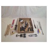 Kitchen Utensil Lot Featuring Knives, Skewers, Sharpening Steels, and Openers