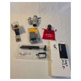 Mixed Electronics Lot Featuring Konica Minolta Camera, Kodak Solar Charger, Monopod, Hearing Aid Batteries, Golf GPS, and Knife Sharpener
