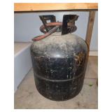 Black Metal Gas Cylinder with Attached Red Hose and Protective Collar