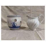 Two Ceramic Vessels Including Blue and White Pierced Pot and White Swirl Cream Pitcher