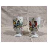 Two Ceramic Footed Mugs with Polychrome Bird and Botanical Motifs