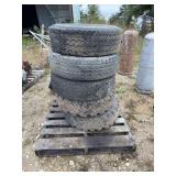 Set of Five Heavy Duty Truck Tires Mounted on Rusting Steel Rims