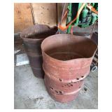 Two Metal Agricultural Containers with Surface Oxidation