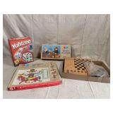 Group of Four Tabletop Games and Construction Sets Including Yahtzee, Tupperware Snapics, Tupperware Busy Blocks, and Wooden Board Game Set