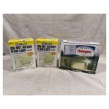 Three Halogen Flood Lights in Packaging Including Two The Designer's Edge L-30 White Lights and One Heath Zenith SL-5503-WH Security Floodlight